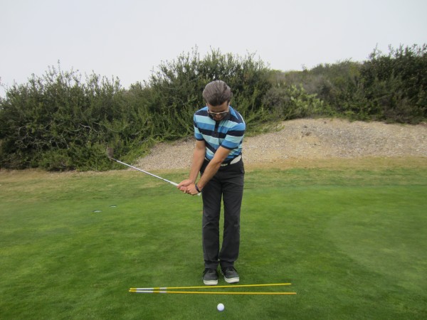 Note the Short Arm Swing, as well as the higher club head/ lower handle relationship. 