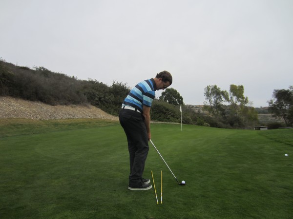 Note how much the body is turning left to help match up the path of the club to an open club face.