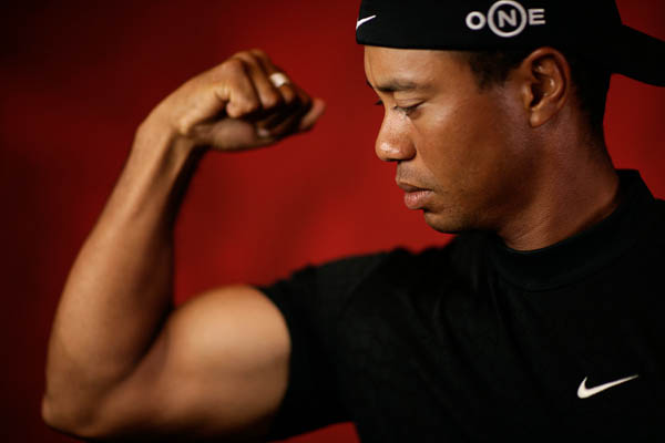 Tiger Woods shows off his muscles to Golf Digest 
