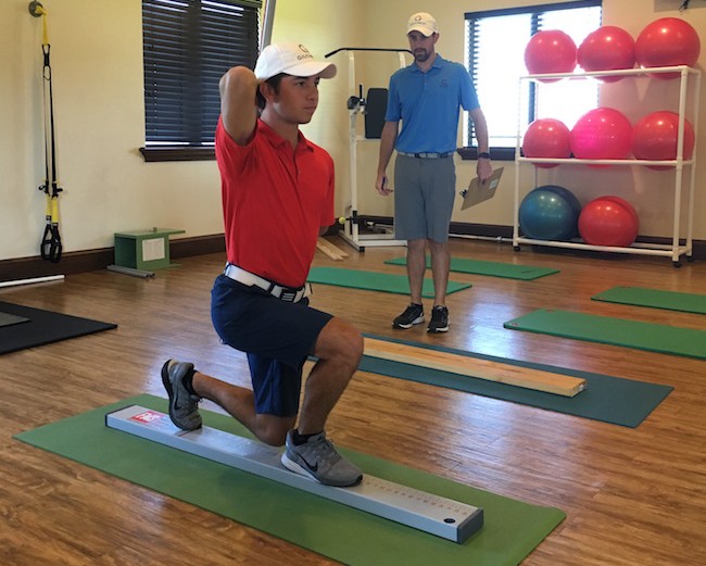 A junior golfer undergoing a physical screening. 